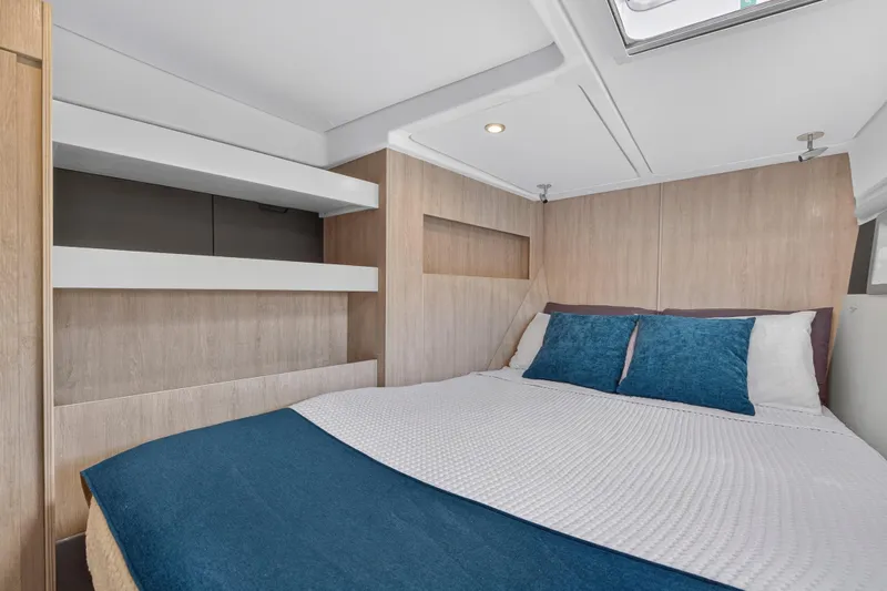 Southern Sky Yacht Photos Pics Cozy bedroom in 2018 Leopard 51 Powercat with modern design and blue accents.