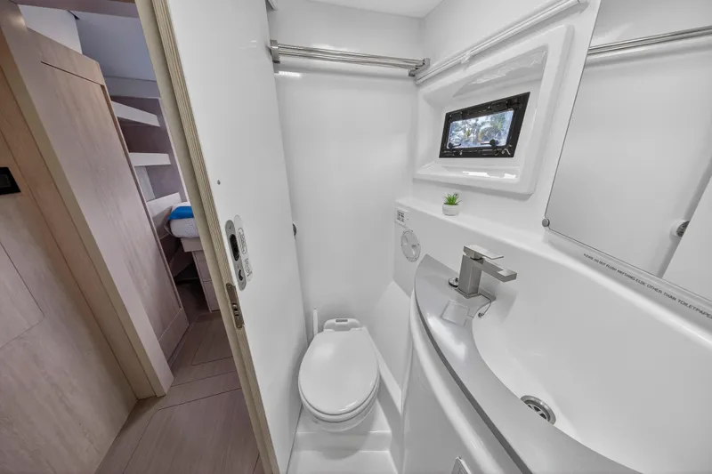 Southern Sky Yacht Photos Pics Bathroom interior of 2018 Leopard 51 Powercat yacht, featuring modern fixtures and compact design.