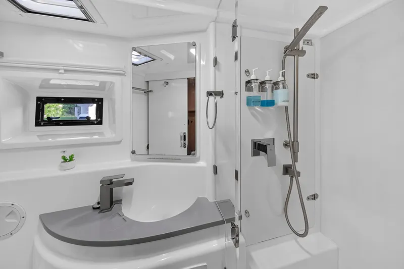 Southern Sky Yacht Photos Pics Modern bathroom in 2018 Leopard 51 Powercat yacht with sleek fixtures and shower amenities.