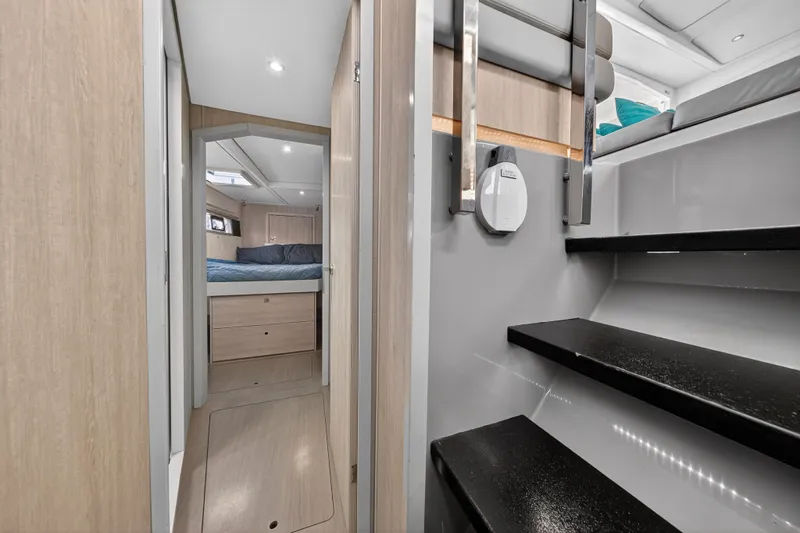 Southern Sky Yacht Photos Pics Interior of 2018 Leopard 51 Powercat, featuring modern cabin and sleek black stairs.