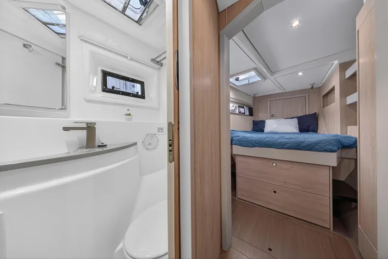 Southern Sky Yacht Photos Pics Luxurious interior of 2018 Leopard 51 Powercat featuring bedroom and bathroom.