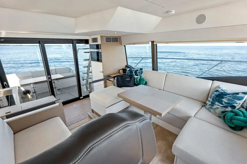Jilligans Island Yacht Photos Pics Luxurious interior of 2023 Prestige 460 Flybridge yacht with ocean view.