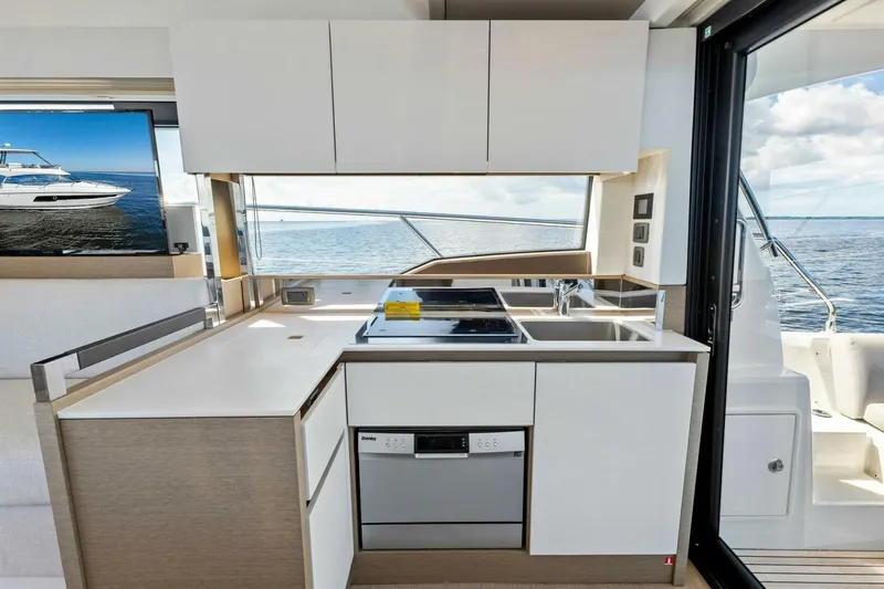 Jilligans Island Yacht Photos Pics Modern kitchen on 2023 Prestige 460 Flybridge yacht with ocean view.