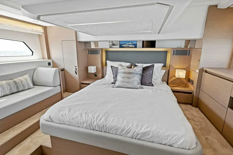 Jilligans Island Yacht Photos Pics Luxurious bedroom interior of 2023 Prestige 460 Flybridge yacht with modern design.