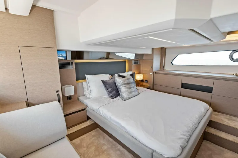 Jilligans Island Yacht Photos Pics Luxurious bedroom interior of 2023 Prestige 460 Flybridge yacht with modern design.