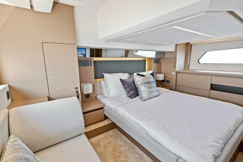 Jilligans Island Yacht Photos Pics Luxurious bedroom interior of 2023 Prestige 460 Flybridge yacht with modern design.