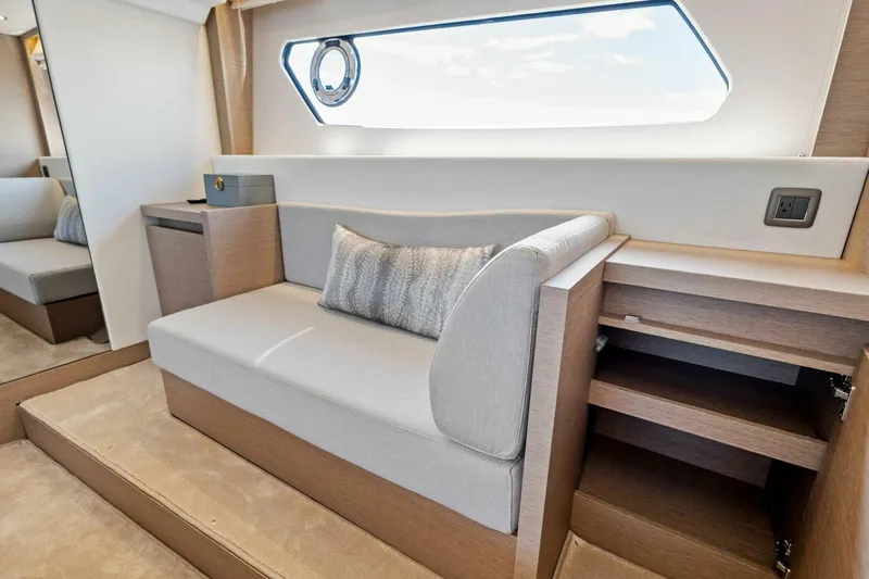 Jilligans Island Yacht Photos Pics Luxurious interior of 2023 Prestige 460 Flybridge yacht with elegant seating and modern design.