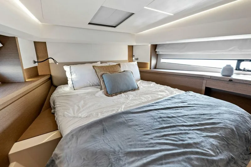 Jilligans Island Yacht Photos Pics Luxurious bedroom interior of 2023 Prestige 460 Flybridge yacht with modern design.