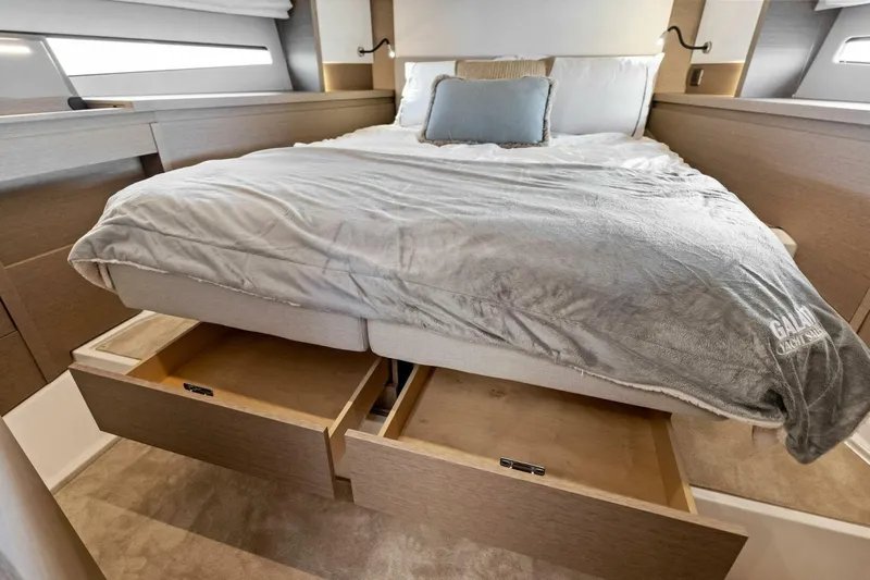 Jilligans Island Yacht Photos Pics Luxurious bedroom with storage drawers in 2023 Prestige 460 Flybridge yacht.