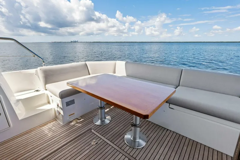 Jilligans Island Yacht Photos Pics Prestige 460 Flybridge 2023 yacht deck with seating and ocean view.