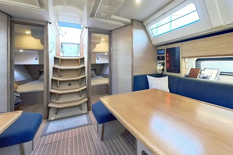 Sea Wave Yacht Photos Pics Luxurious interior of 2024 Kufner 54 yacht with modern seating and wooden finishes.