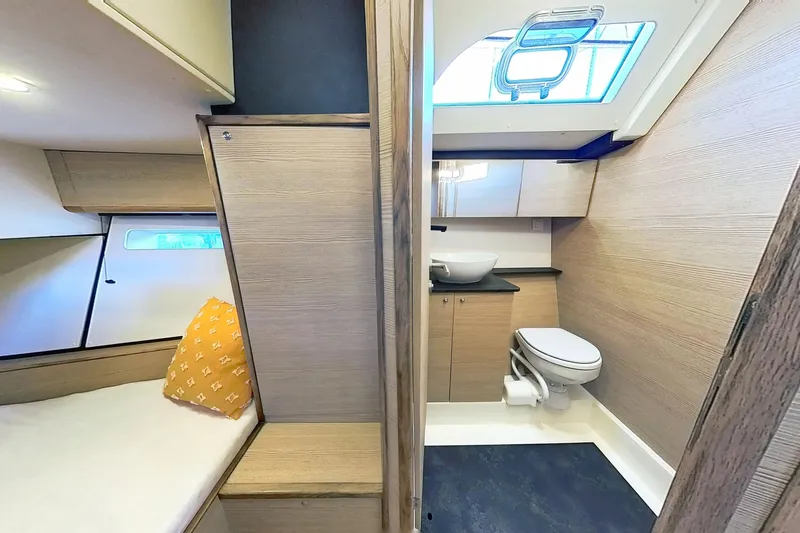 Sea Wave Yacht Photos Pics 2024 Kufner 54 yacht interior with modern bathroom and cozy cabin.