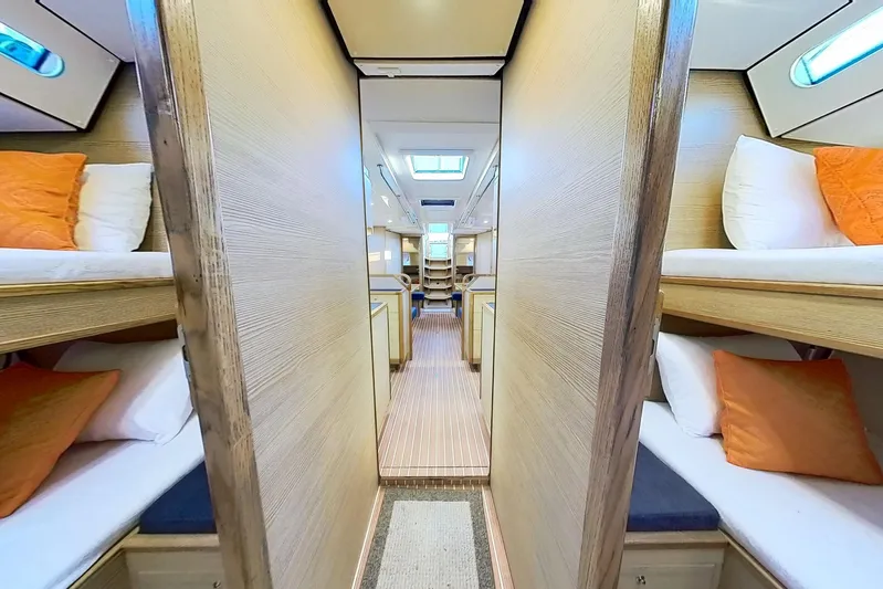 Sea Wave Yacht Photos Pics Luxurious interior of 2024 Kufner 54 yacht with cozy bunk beds and modern design.