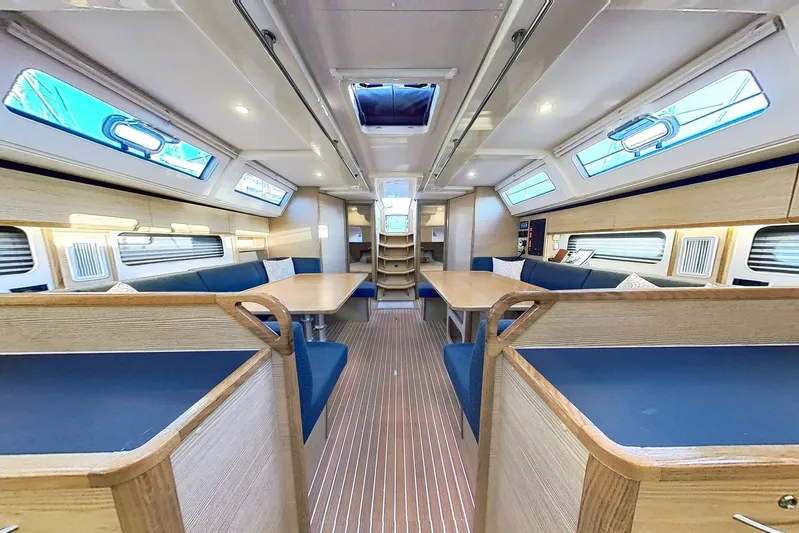 Sea Wave Yacht Photos Pics Luxurious interior of 2024 Kufner 54 yacht with modern seating and ample natural light.