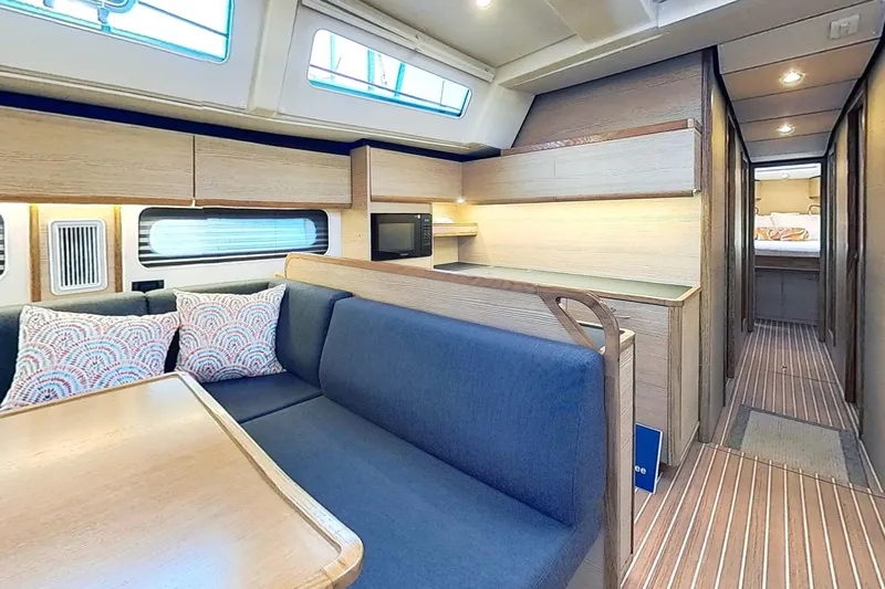 Sea Wave Yacht Photos Pics Modern interior of 2024 Kufner 54 yacht with cozy seating and stylish decor.