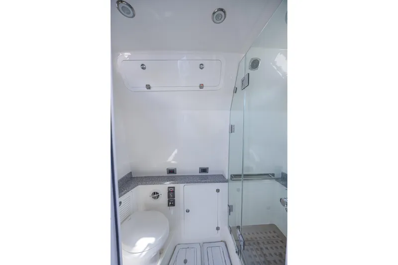 2022 425 Yamahas Yacht Photos Pics 2019 HCB 53 Sue&ntilde;os yacht bathroom with modern fixtures and glass shower.