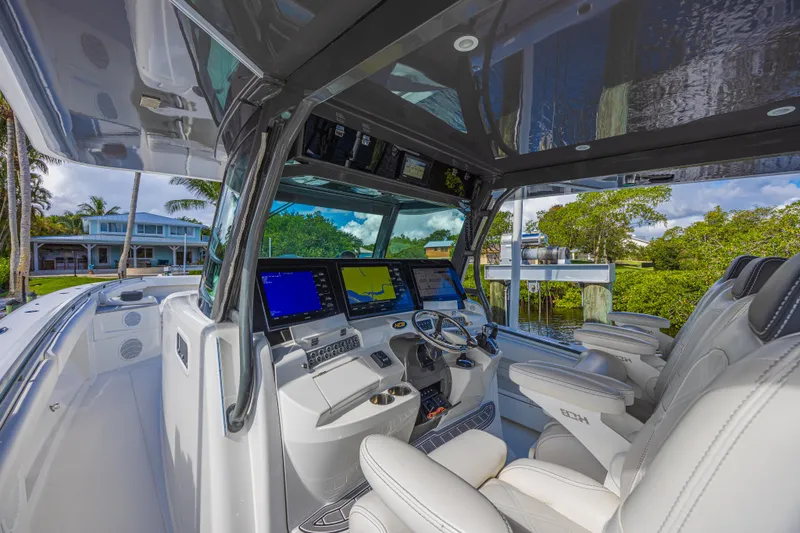 2022 425 Yamahas Yacht Photos Pics Interior view of 2019 HCB 53 Sue&ntilde;os boat with advanced navigation system and luxurious seating.
