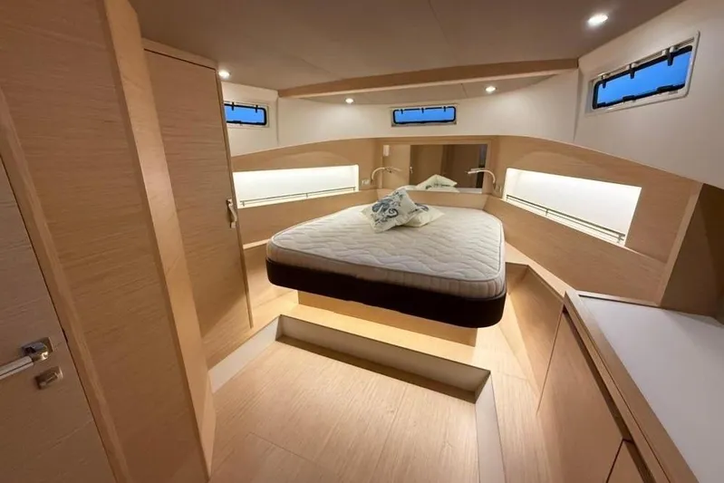  Yacht Photos Pics Luxurious interior cabin of 2022 Solaris Power 44 yacht with modern design and cozy bed.