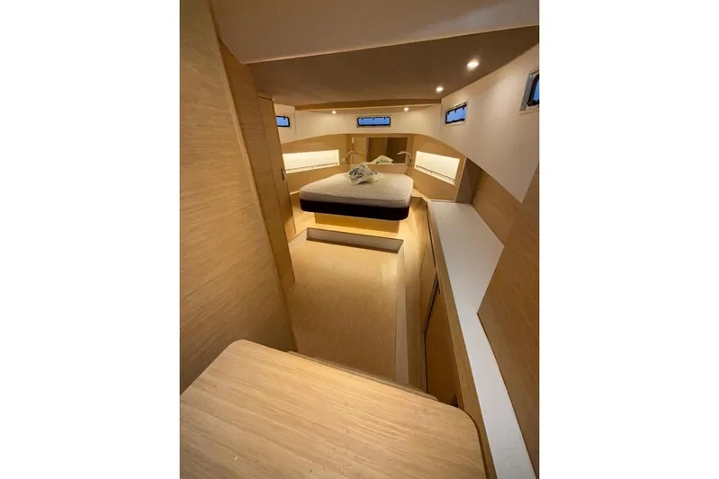  Yacht Photos Pics Luxurious interior of 2022 Solaris Power 44 yacht with modern wood finish.