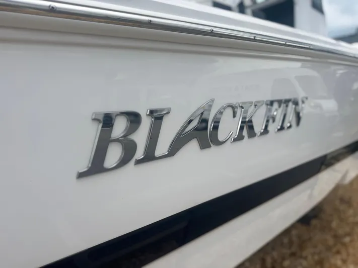  Yacht Photos Pics 2026 Blackfin 262 HB boat with sleek white exterior and chrome logo.