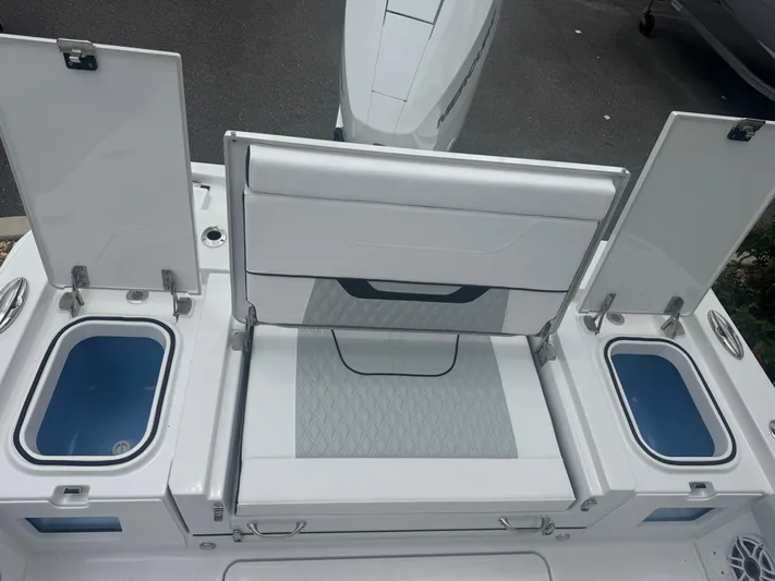  Yacht Photos Pics 2026 Blackfin 262 HB boat with open storage compartments and seating area.