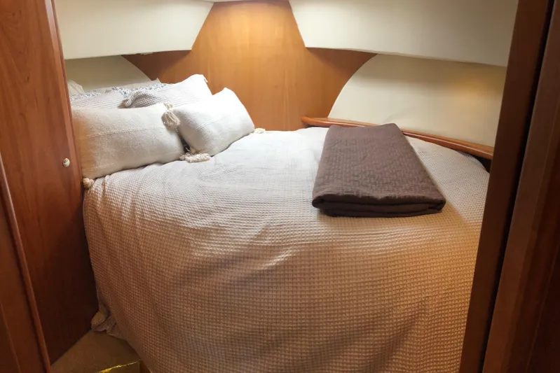 Joie De Vivre Yacht Photos Pics Cozy bedroom interior of 2003 Silverton 35 Motor Yacht with plush bedding.