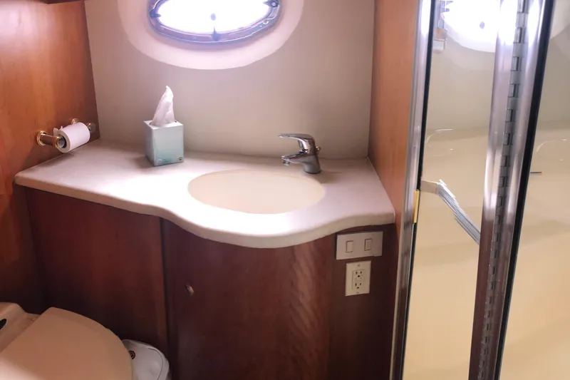 Joie De Vivre Yacht Photos Pics Bathroom interior of 2003 Silverton 35 Motor Yacht with sink and shower.