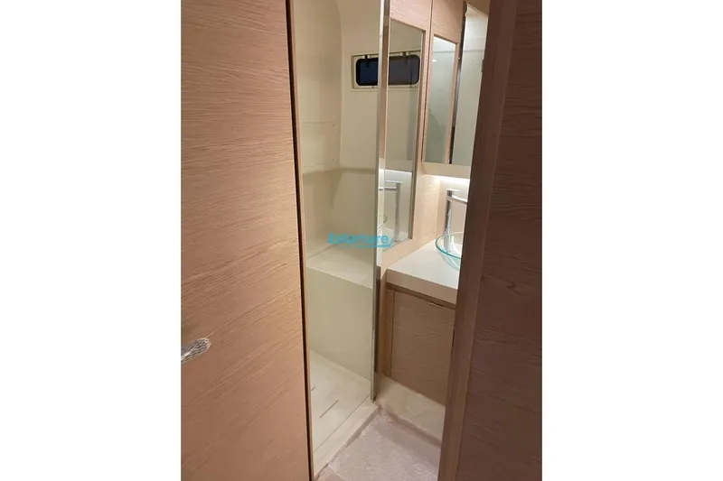  Yacht Photos Pics 2024 Solaris Power 44 Open yacht bathroom with modern design and wooden accents.