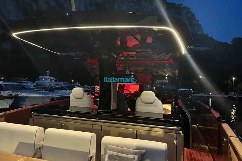  Yacht Photos Pics 2024 Solaris Power 44 Open yacht interior at night, featuring modern lighting and seating.