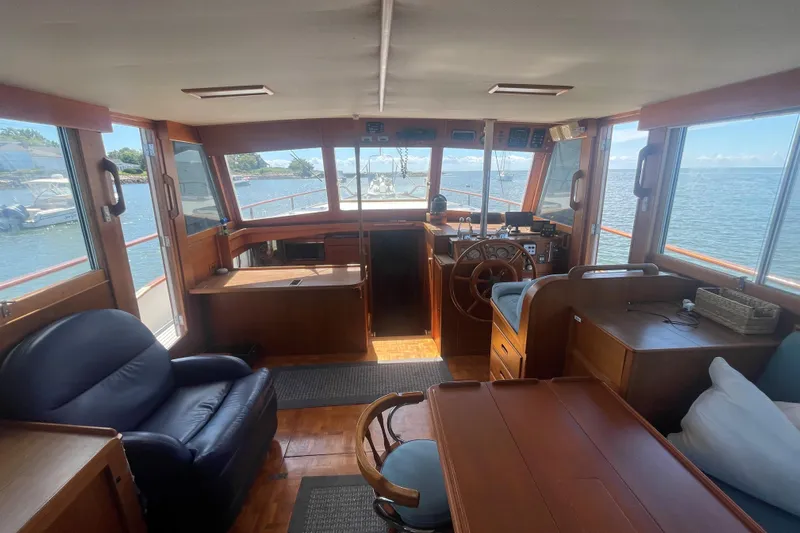 Island Girl Yacht Photos Pics Interior of 1990 Grand Banks 46 Classic yacht with wooden furnishings and ocean view.