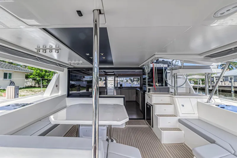  Yacht Photos Pics Spacious interior of 2020 Leopard 45 catamaran with modern seating and dining area.