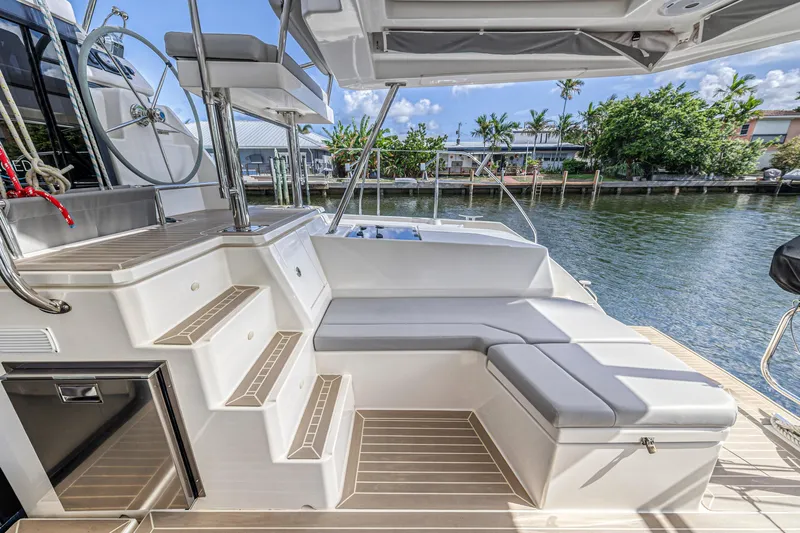  Yacht Photos Pics Leopard 45 yacht deck with seating, steering wheel, and waterfront view, 2020 model.