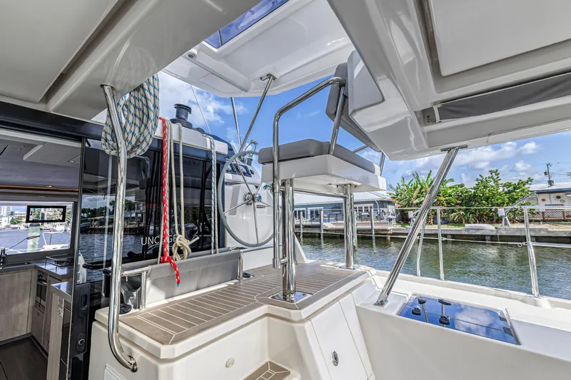  Yacht Photos Pics Modern Leopard 45 catamaran interior, showcasing helm station and sleek design, 2020 model.