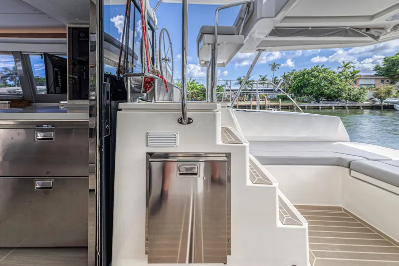  Yacht Photos Pics Leopard 45 yacht interior with modern design, featuring stainless steel appliances and outdoor seating.