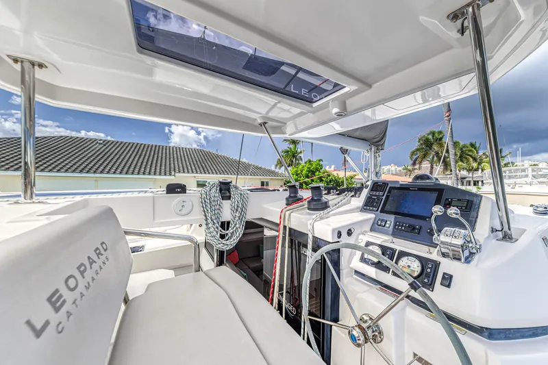  Yacht Photos Pics Helm of 2020 Leopard 45 catamaran with navigation equipment and steering wheel.