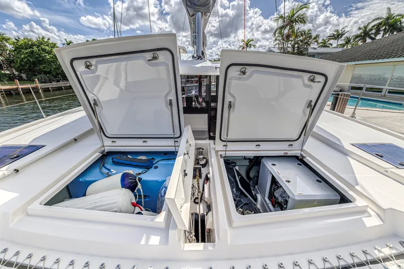  Yacht Photos Pics Open storage compartments on a 2020 Leopard 45 catamaran, showcasing equipment and engine.