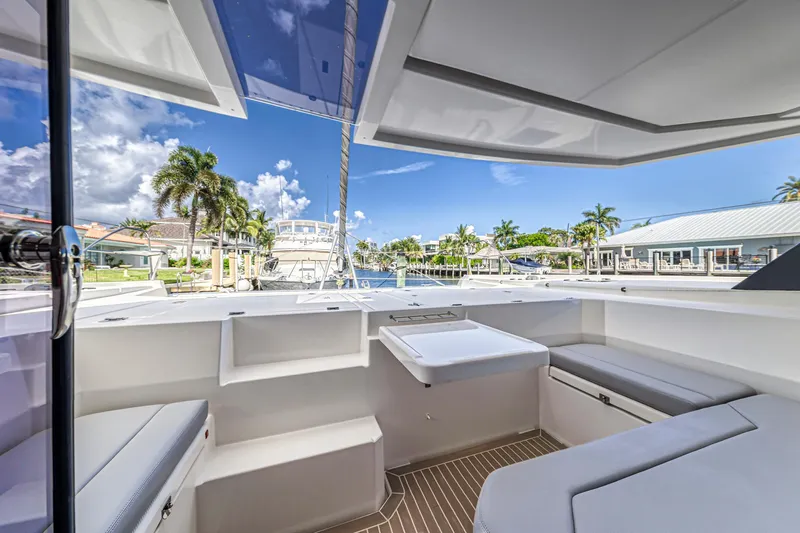  Yacht Photos Pics 2020 Leopard 45 yacht interior with modern seating, docked in a sunny marina.