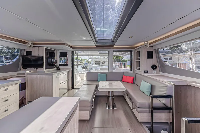  Yacht Photos Pics Luxurious interior of 2020 Leopard 45 catamaran with modern seating and skylight.
