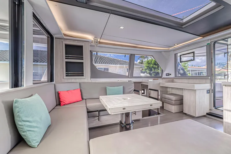 Yacht Photos Pics Luxurious interior of a 2020 Leopard 45 catamaran with modern seating and large windows.