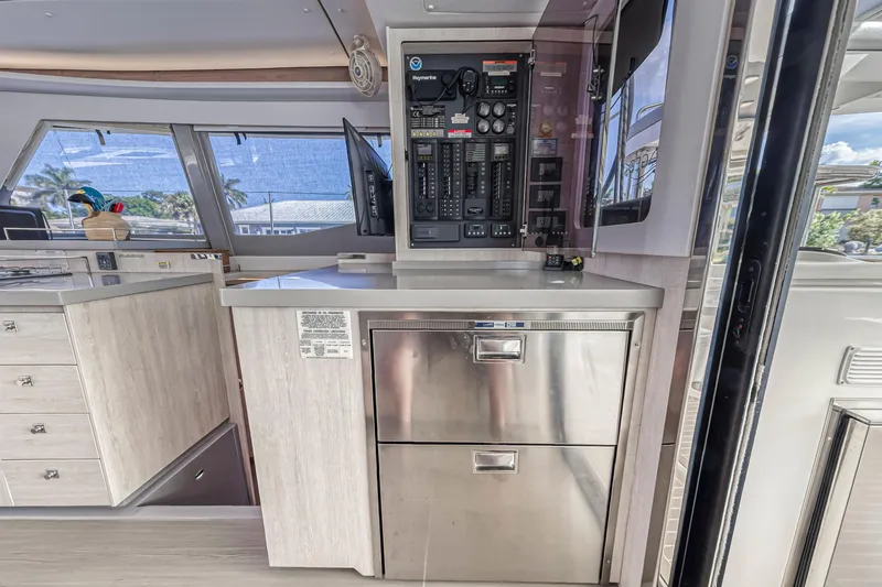  Yacht Photos Pics Interior of 2020 Leopard 45 yacht with control panel and stainless steel drawers.