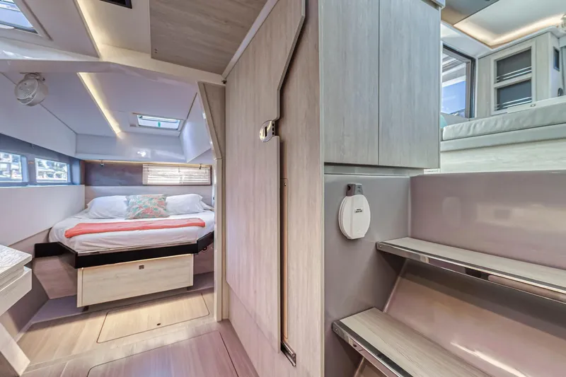  Yacht Photos Pics Modern interior of 2020 Leopard 45 catamaran featuring cozy bedroom and sleek design.