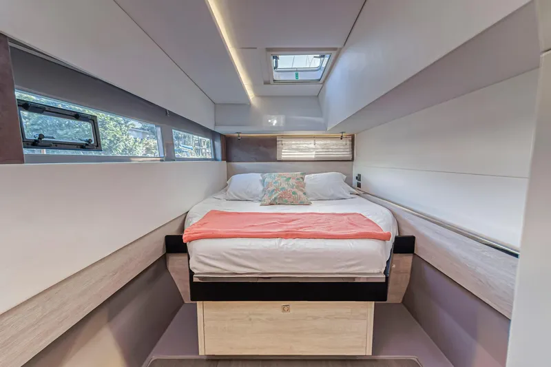  Yacht Photos Pics Luxurious bedroom interior of 2020 Leopard 45 yacht with modern design and skylight.