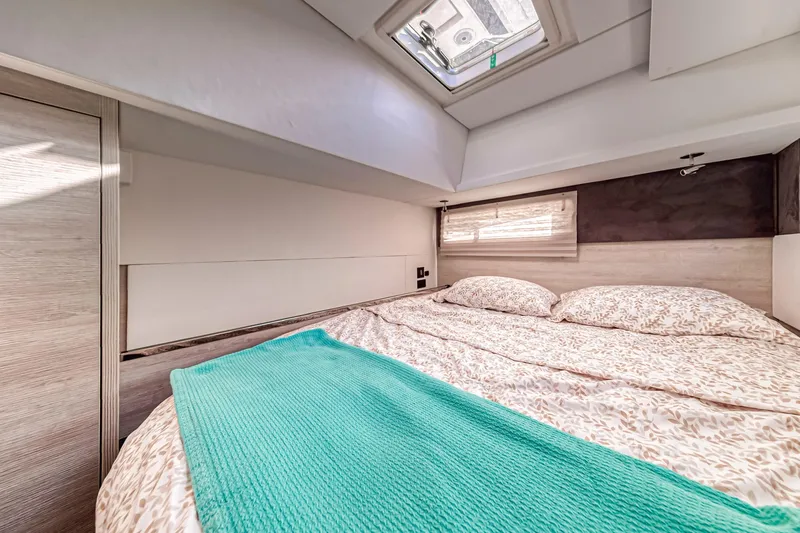  Yacht Photos Pics Cozy bedroom in 2020 Leopard 45 yacht with skylight and modern decor.