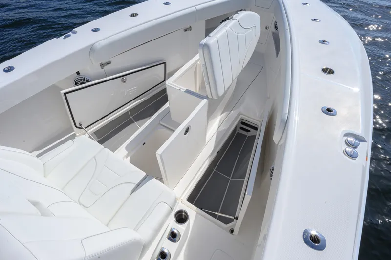  Yacht Photos Pics 2025 SeaVee 370Z boat interior with white seating and storage compartments.