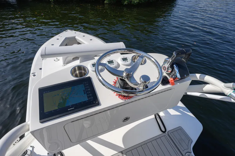  Yacht Photos Pics Helm of 2025 SeaVee 370Z boat with navigation display and controls on water.