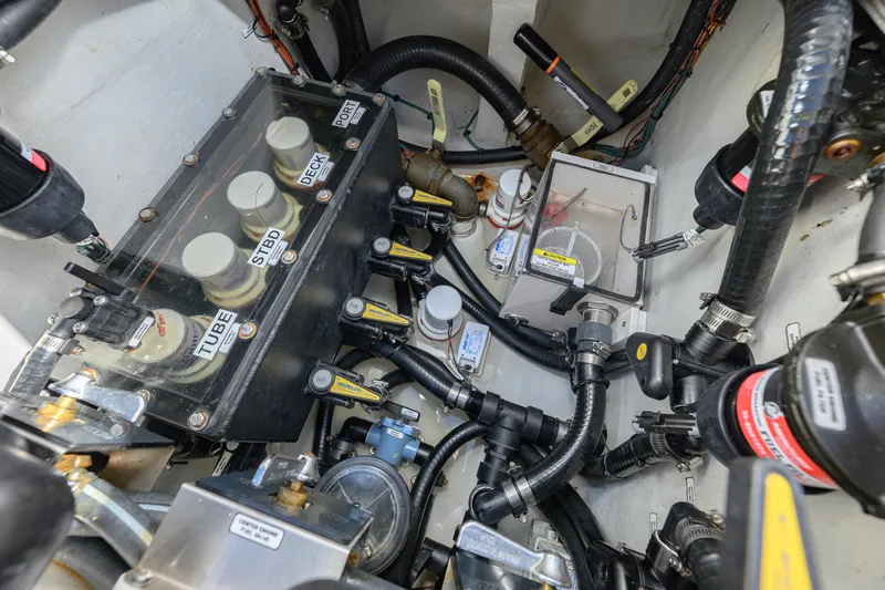  Yacht Photos Pics Engine compartment of 2025 SeaVee 370Z boat, showcasing complex wiring and components.