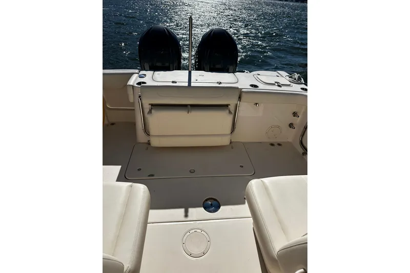  Yacht Photos Pics 2023 Grady-White Freedom 307 boat interior with dual engines on water.