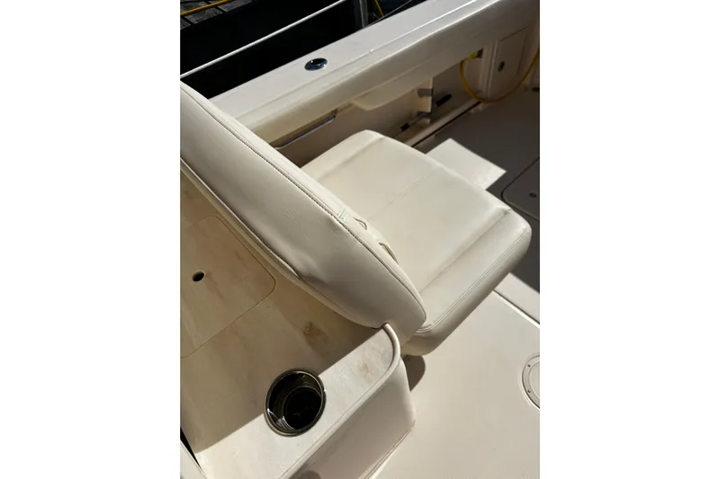  Yacht Photos Pics 2023 Grady-White Freedom 307 boat interior with white seating and cup holder.