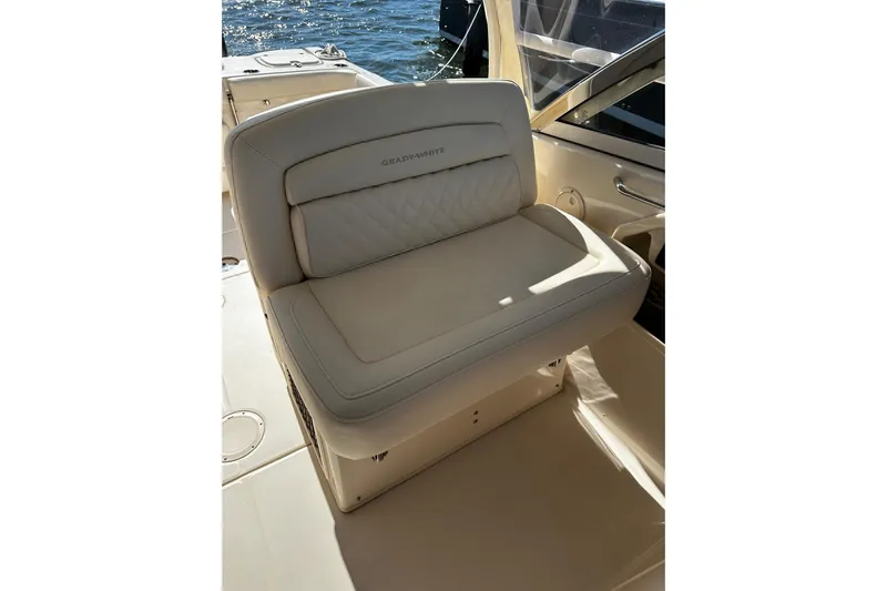  Yacht Photos Pics 2023 Grady-White Freedom 307 boat seat, beige leather, on deck with water view.