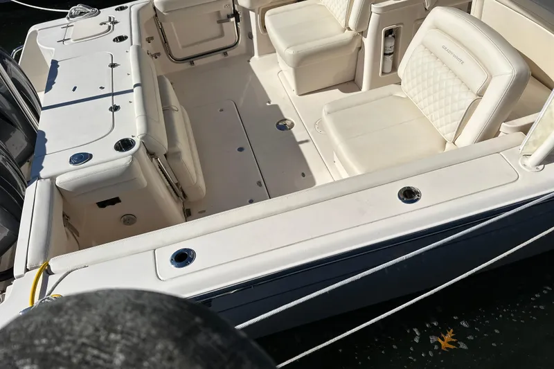  Yacht Photos Pics 2023 Grady-White Freedom 307 boat interior with white seating and deck details.